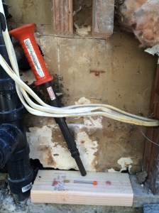 New sole plate installed. This is a "powder activated" hammer, meaning that it uses a .22 caliber shell to power a hammer. The nail has an orange centering bushing that holds the nail in the "muzzle" of the hammer. You whap the end of the tool with your regular hammer, and that fires the shell and drives the nail right into the concrete. I bought this years ago for attaching furring to a concrete wall, and I've used it countless times since. A must-have if you want to attach something to concrete.