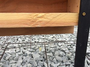 Bottom of plywood on form extends down to allow for concrete to flow between levels to allow a monolithic slab without a lot of fuss in removing the form to finish the faces.