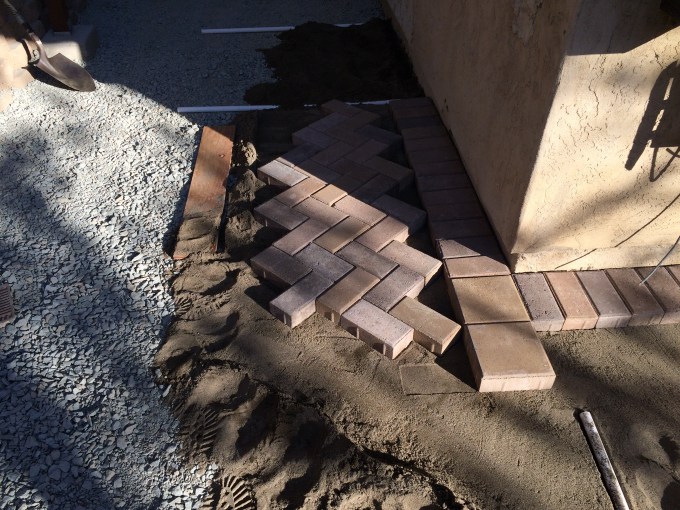 Stepping Stones. Lay enough brick so you can step on it (carefully) and work your way out.