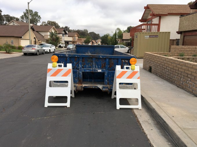 The dumpster, delivered and ready to receive.